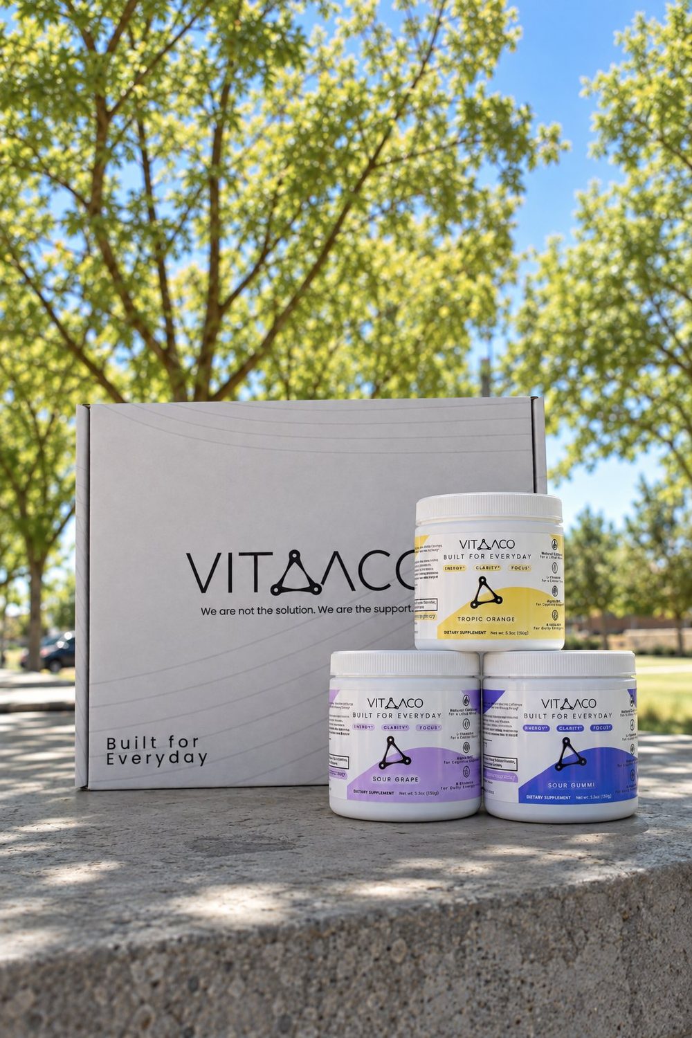 Vitaaco welcome box with Tropic Orange, Sour Grape and Sour Gummi tubs