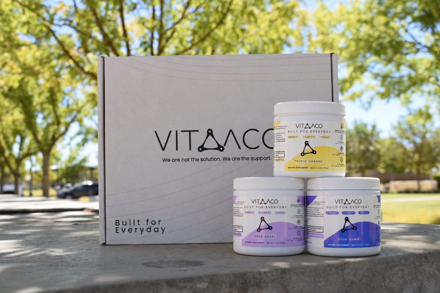 Vitaaco welcome box with Tropic Orange, Sour Grape and Sour Gummi tubs
